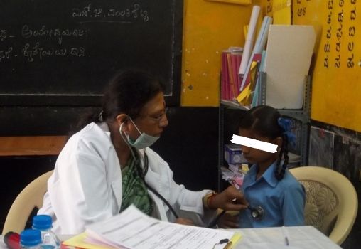 Doctor treating a girl in a private clinic