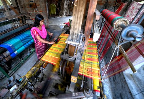 woman weaving saree